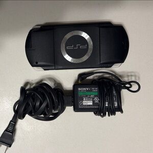 Sony PSP Slim Portable Gaming System in Black with Silver Ring